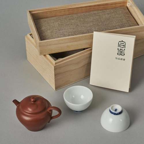 A Chinese Red Clay Teapot (Zhao Fei Zhi Mark) and Two White-...