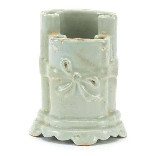 Chinese porcelain brush pot in the form of two scrolls havin...