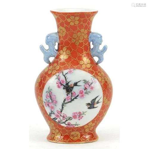 Chinese iron red ground porcelain vase with twin handles han...
