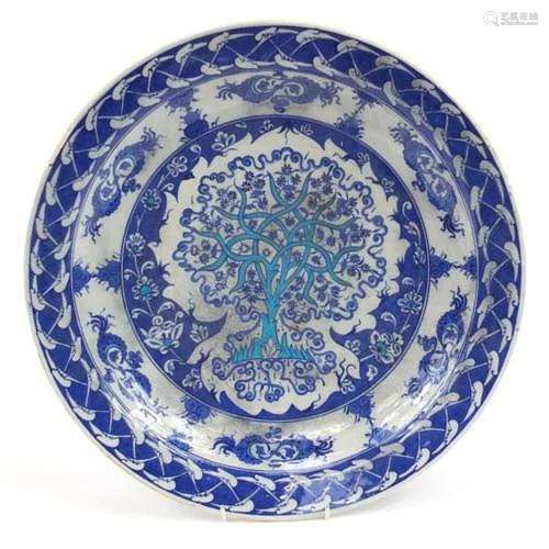 Turkish Iznik pottery charger hand painted with stylised tre...