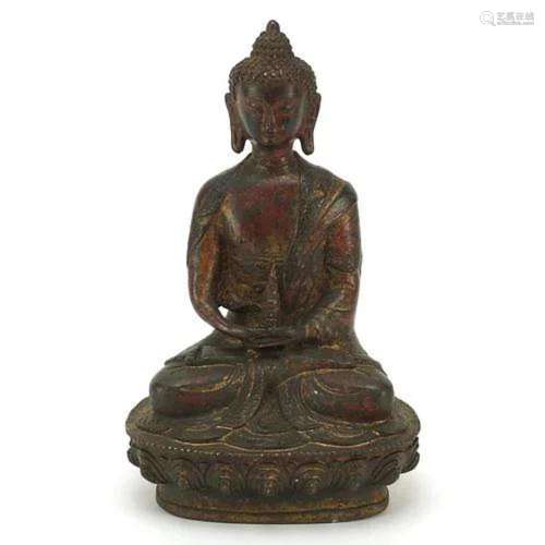 Chino Tibetan patinated bronze figure of seated Buddha, 19.5...