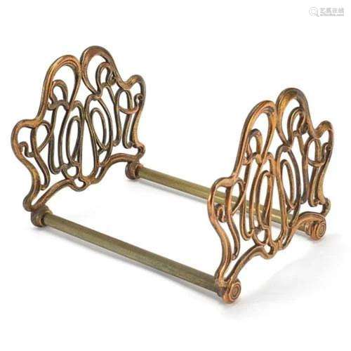 Art Nouveau coppered brass sliding book rack, 21cm adjusting...