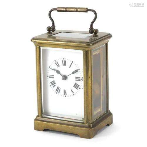 Brass cased carriage clock with swing handle, 11.5cm high