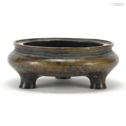 Chinese patinated bronze tripod censer, character marks to t...