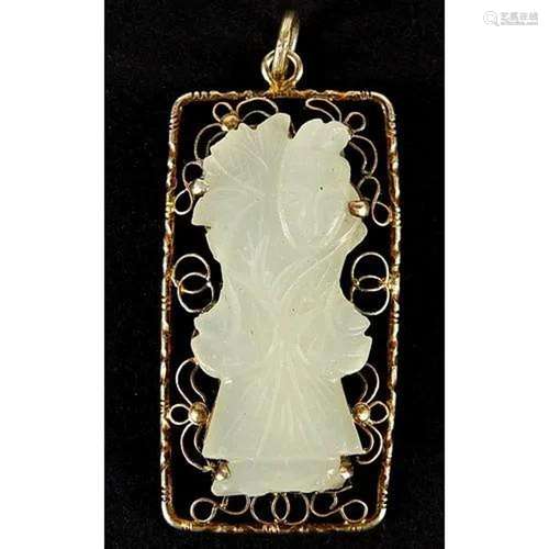 Chinese silver gilt pendant housing a pale green jade panel ...