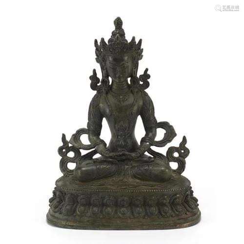 Chino Tibetan patinated bronze figure of seated Buddha, 29.5...