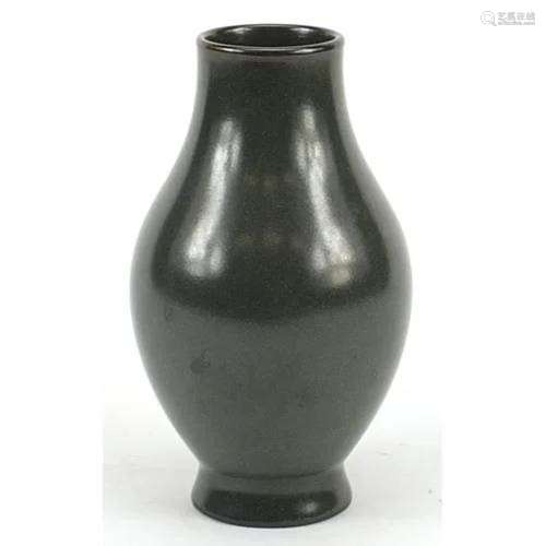 Chinese porcelain vase having a tea powder glaze, six figure...
