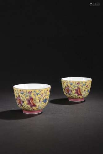 PAIR OF CHINESE YELLOW GROUND FAMILLE ROSE CUPS