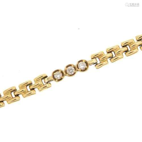 Gold bracelet set with clear stones, indistinct marks to the...