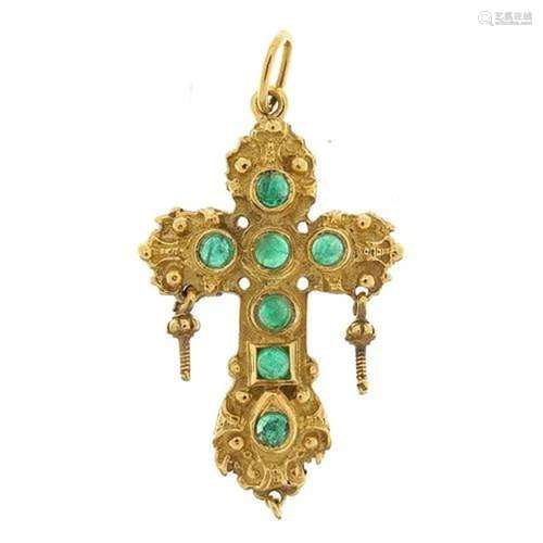 Ornate 9ct gold cross pendant set with cabochon green stones...