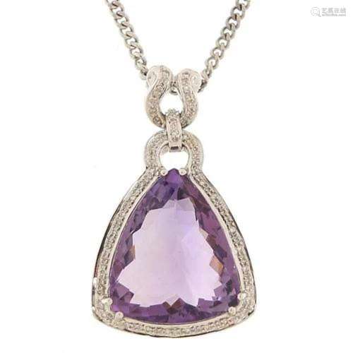 Large 18ct white gold amethyst and diamond pendant on an 18c...