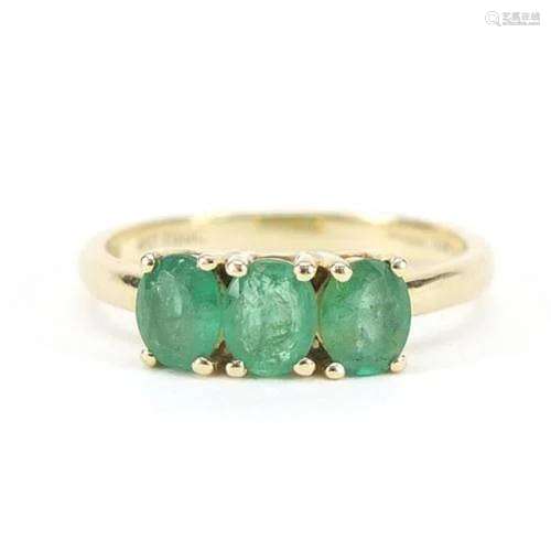 10ct gold emerald three stone ring, size J, 1.6g