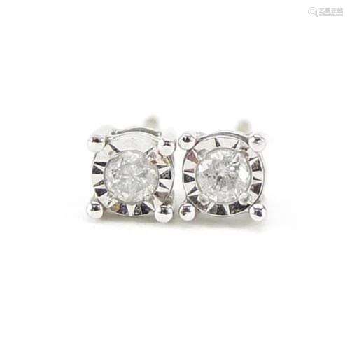 Pair of 9ct gold diamond solitaire earrings, 4mm in diameter...
