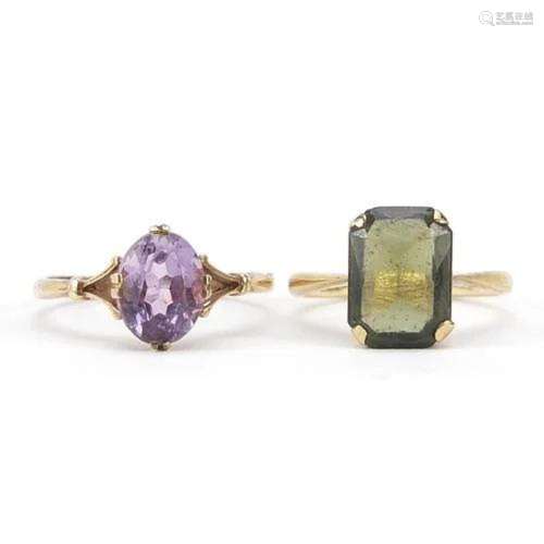 Two 9ct gold rings set with an amethyst and green stone, siz...