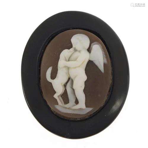 Antique jet and cameo brooch depicting a cherub and dog, 2.8...