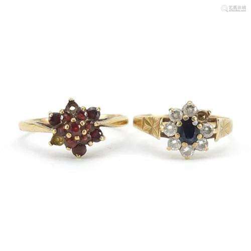 Two 9ct gold rings set with garnets, sapphire and clear ston...