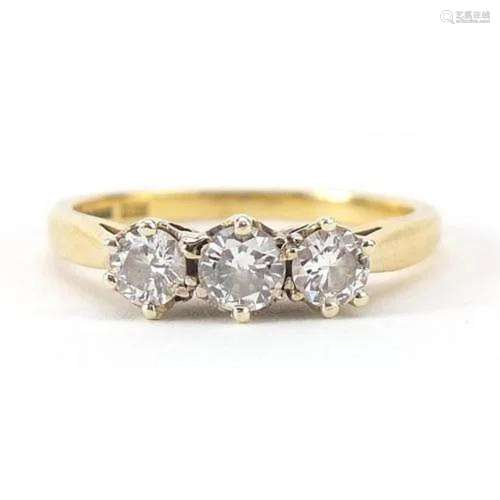 18ct gold diamond three stone ring, total diamond weight app...