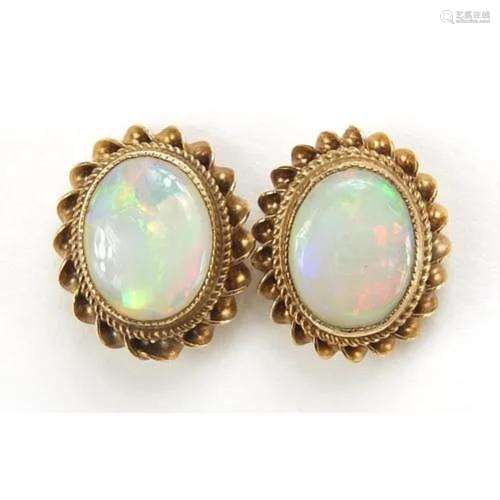 Pair of 9ct gold cabochon opal stud earrings, 1.3cm high, 2....