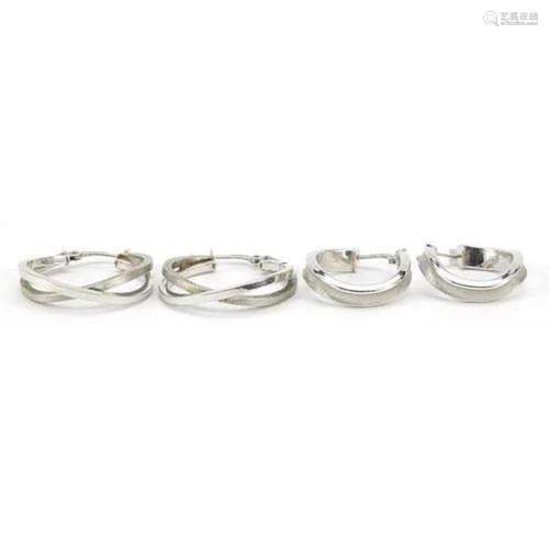 Two pairs of 9ct white gold hoop earrings, the largest 2.3cm...