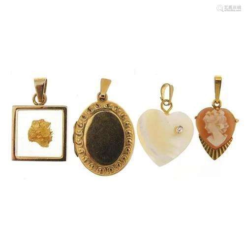 Three gold coloured pendants and a rolled gold locket includ...