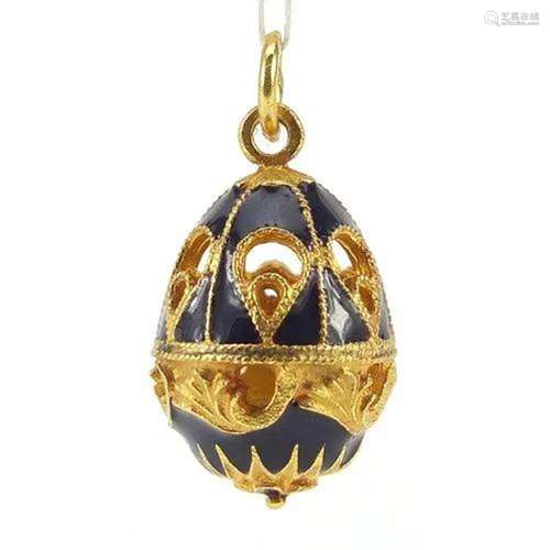 Russian gilt metal and enamel egg pendant with box, 2.8cm hi...