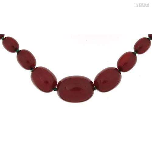 Cherry amber coloured graduated bead necklace, the largest b...