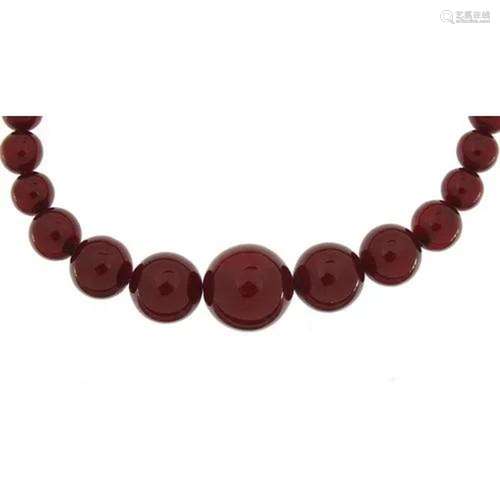 Cherry amber coloured graduated bead necklace, the largest b...