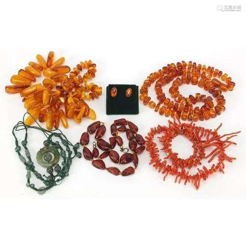 Assorted jewellery comprising three natural and Baltic amber...