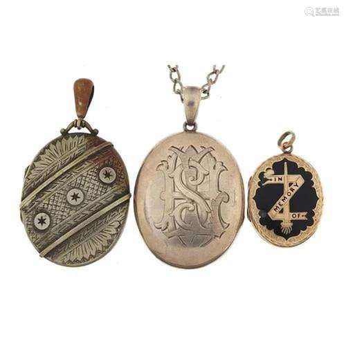 Three lockets including a black enamel mourning locket and V...