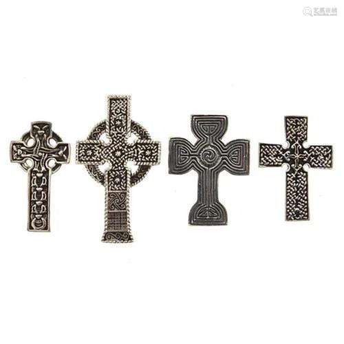 Four silver Celtic cross pendants, the largest 4.7cm high, t...