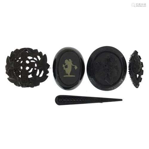 Five antique Whitby jet brooches, the largest 7.5cm in lengt...