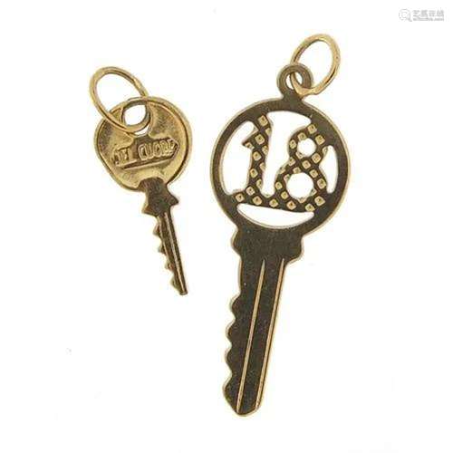 Two unmarked gold key charms including no 18, the largest 2....