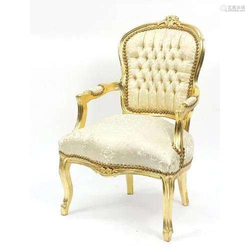 French style gilt framed open armchair with cream and gold u...