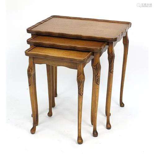 Nest of three carved walnut occasional tables, 55cm H x 53cm...