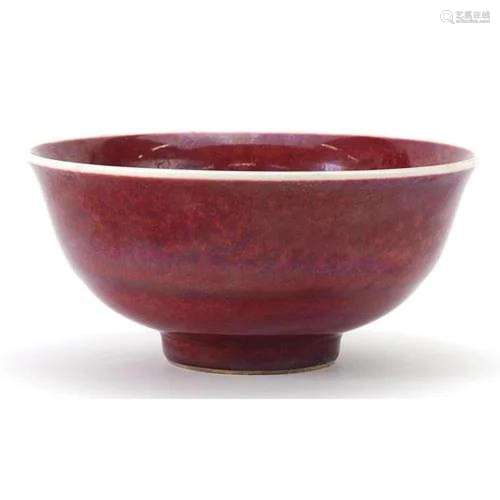 Chinese porcelain bowl having a sang de boeuf glaze, six fig...
