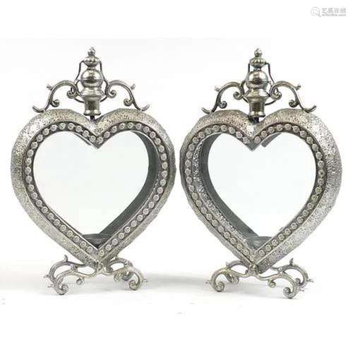 Pair of ornate silvered metal love heart candle holders with...