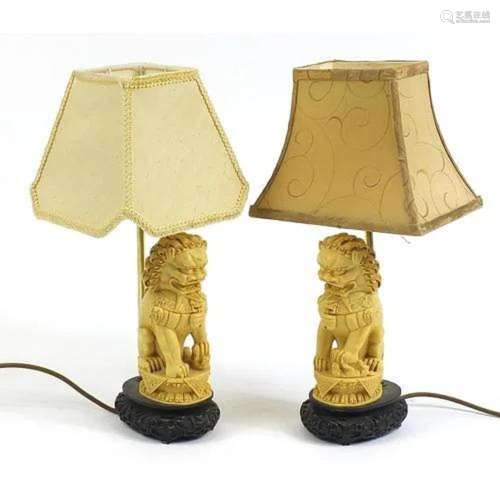Pair of Chinese ivorine Foo dog table lamps with shades, 41c...