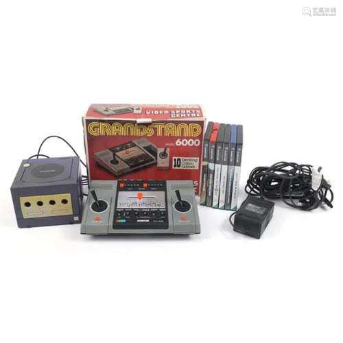 Nintendo Gamecube with a collection of games and Grandstand ...