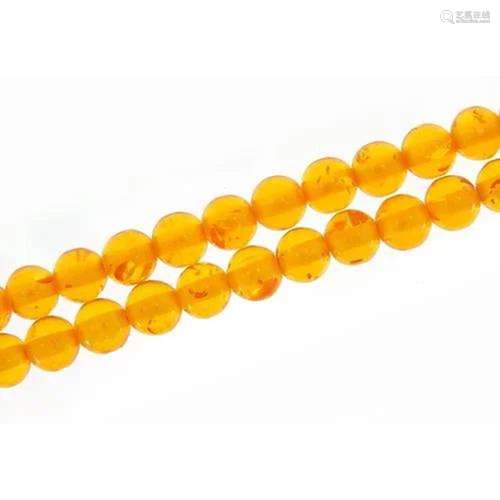 Amber coloured bead necklace, 110cm in length, 81.0g