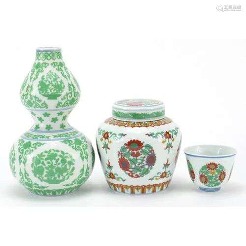 Chinese porcelain decorated with flowers comprising a double...