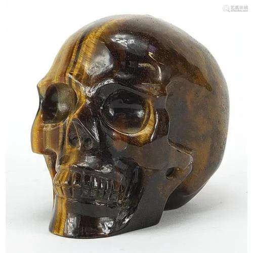 Carved tiger's eye human skull, 8cm in length