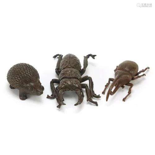 Three Japanese patinated bronze animals comprising two beetl...