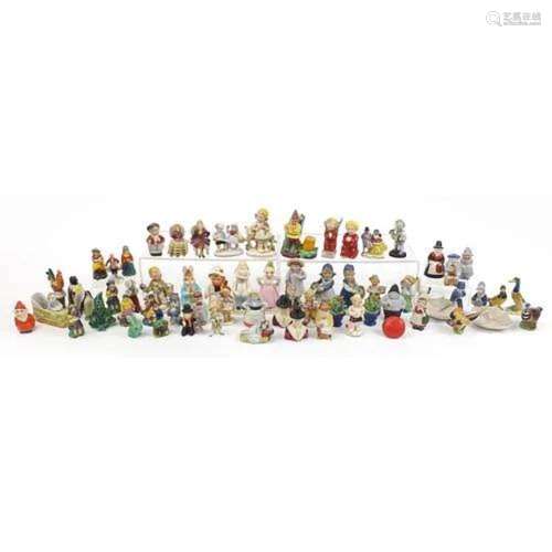 Collection of continental porcelain figures, sifters and nov...