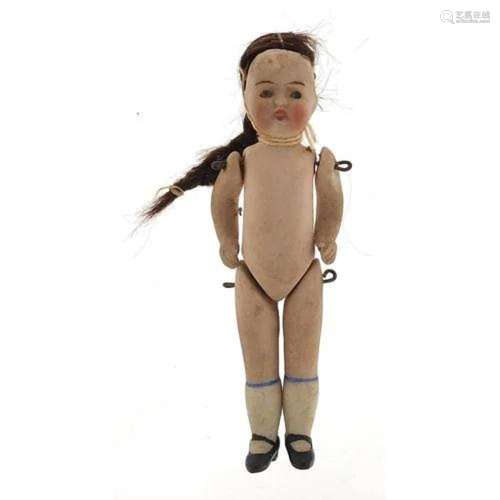 19th century miniature bisque doll with jointed limbs, 9cm h...