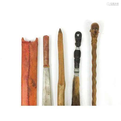 Tribal interest items including a walking stick with carved ...