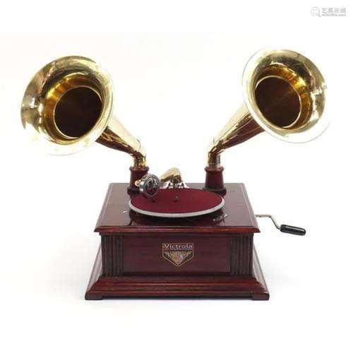 Mahogany wind up gramophone with two brass horns