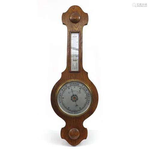 Oak wall hanging aneroid barometer, 67cm high