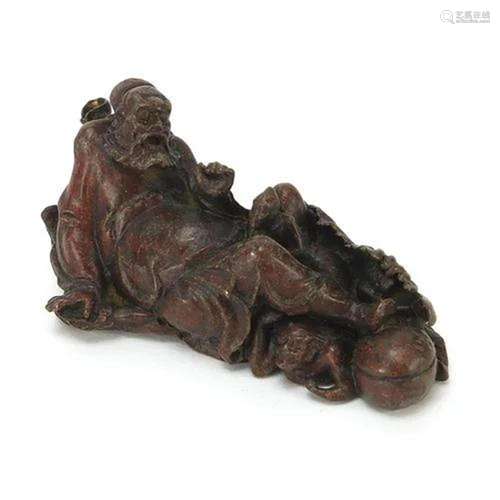 Japanese patinated bronze figure with a demon 5.5cm in lengt...