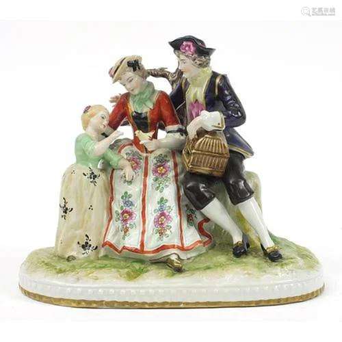 Continental figure group of a mother and father with bird an...