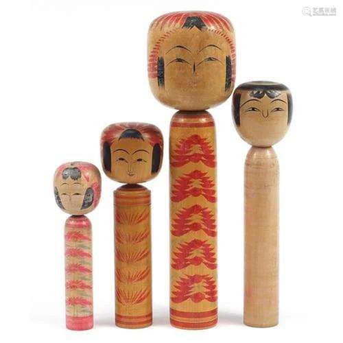 Four large Japanese Kokeshi dolls, the largest 86cm high